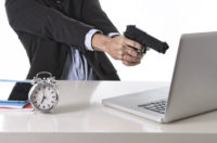 Image of gun and laptop